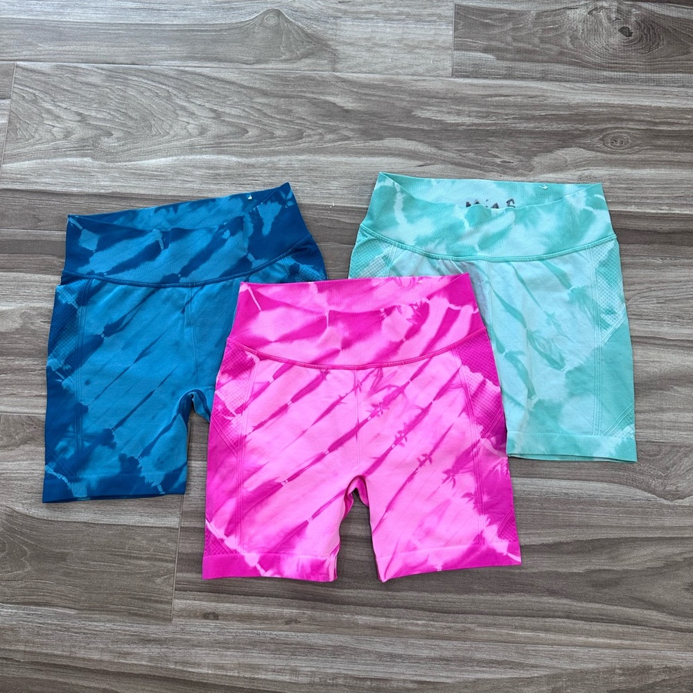 New never worn 3 pairs of stretchy biker shorts. Green, blue and pink!
